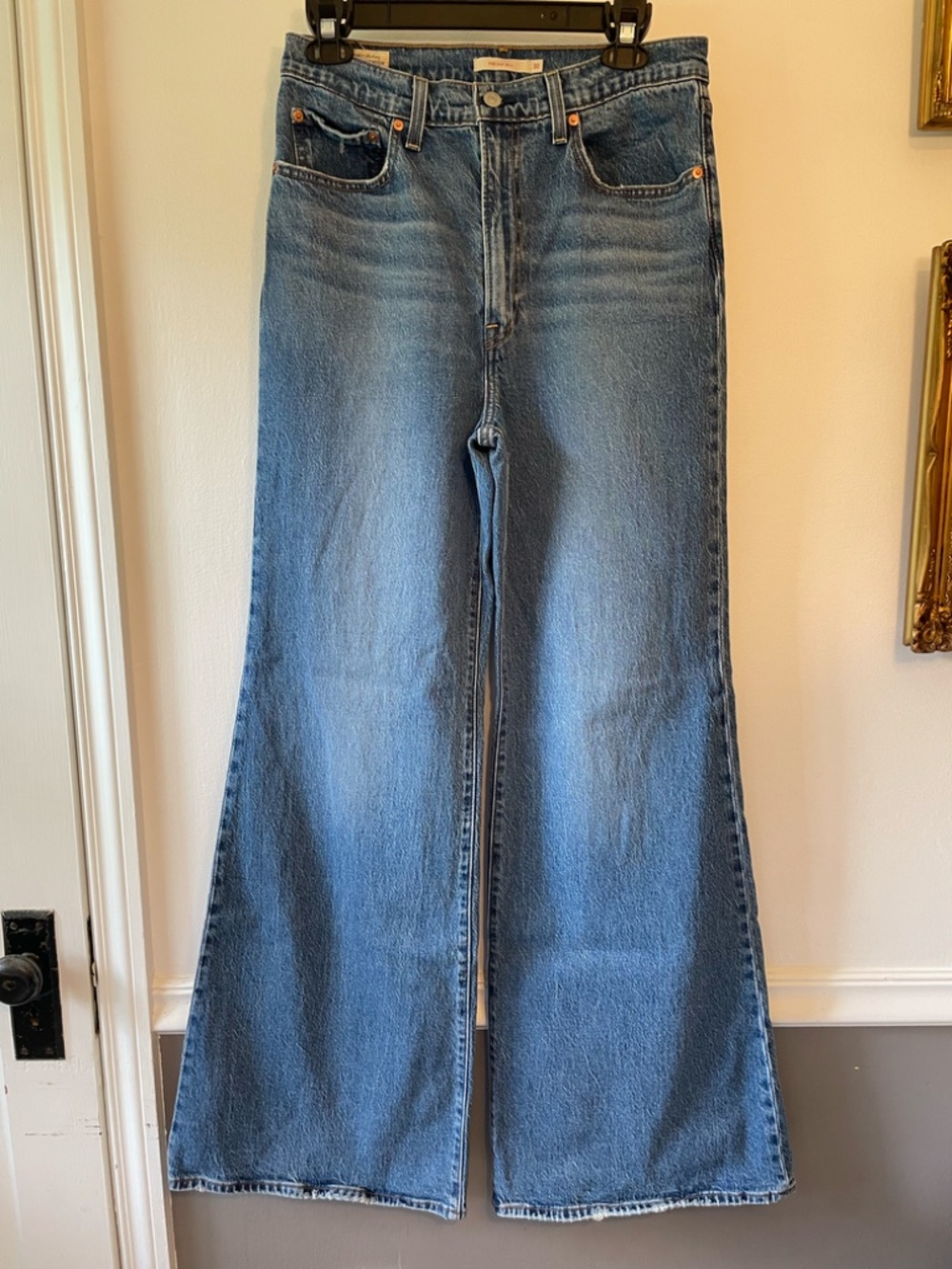 Levi's Ribcage Bell 70s flare-leg ultra high rise jeans in medium-wash size 30